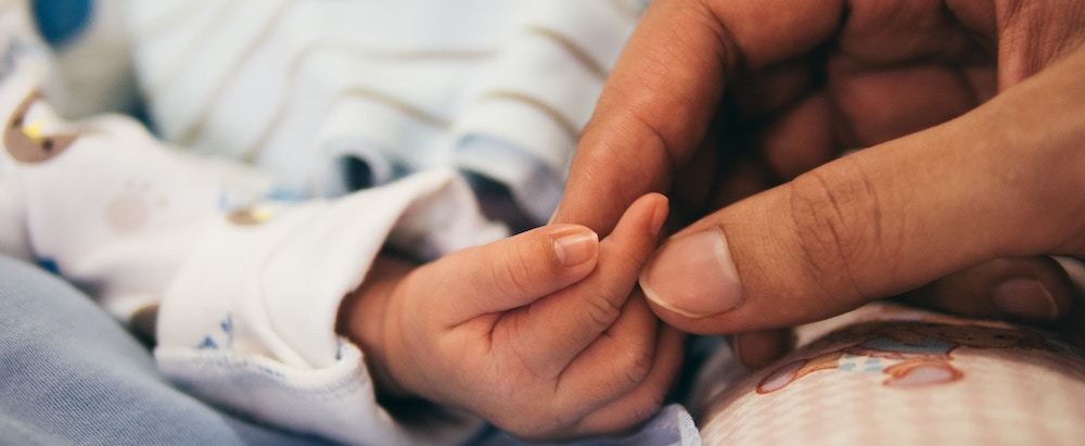 mother and newborn baby hands